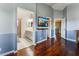 Main bedroom with hardwood floors and a view of the ensuite bathroom at 6112 Browning Way, Las Vegas, NV 89130