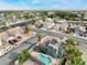 Aerial shot of a neighborhood showcasing a charming home with solar panels, a pool, and lush landscaping at 6112 Browning Way, Las Vegas, NV 89130