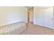 Simple bedroom with a twin bed and double door closet at 632 Confidence St, Henderson, NV 89011