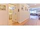 Bright hallway with light wood floors and a powder room at 632 Confidence St, Henderson, NV 89011