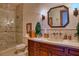 Spa-like bathroom with a large vanity, custom tile, and a walk-in shower at 66 Innisbrook Ave, Las Vegas, NV 89113