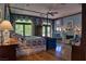 Spacious main bedroom with hardwood floors, fireplace, and large windows at 66 Innisbrook Ave, Las Vegas, NV 89113