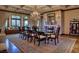 Spacious dining room featuring a large table, chandelier, and built-in seating at 66 Innisbrook Ave, Las Vegas, NV 89113