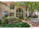 Beautiful home exterior with a large patio and lush landscaping at 66 Innisbrook Ave, Las Vegas, NV 89113