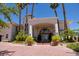 Mediterranean style home with tile roof, grand entrance, and lush landscaping at 66 Innisbrook Ave, Las Vegas, NV 89113