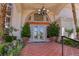 Elegant double front doors with terracotta tile flooring and ornate details at 66 Innisbrook Ave, Las Vegas, NV 89113