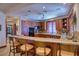 Gourmet kitchen with breakfast bar, custom cabinetry, and high-end appliances at 66 Innisbrook Ave, Las Vegas, NV 89113