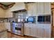 Gourmet kitchen boasts stainless steel appliances and custom cabinetry at 66 Innisbrook Ave, Las Vegas, NV 89113