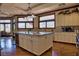 Spacious kitchen with island, granite countertops, and hardwood floors at 66 Innisbrook Ave, Las Vegas, NV 89113
