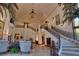 Grand two-story living room with ornate staircase at 66 Innisbrook Ave, Las Vegas, NV 89113