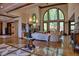 Spacious living room with hardwood floors, large windows, and a fireplace at 66 Innisbrook Ave, Las Vegas, NV 89113