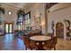 Spacious living room with seating and round table at 66 Innisbrook Ave, Las Vegas, NV 89113