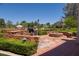 Elegant outdoor kitchen with stone counters and built-in grill at 66 Innisbrook Ave, Las Vegas, NV 89113