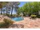 Inviting pool area with flagstone patio and lush landscaping at 66 Innisbrook Ave, Las Vegas, NV 89113