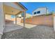 Spacious backyard with gravel and covered patio at 7174 Steubling Glen St, North Las Vegas, NV 89084