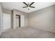 Well-lit bedroom with ceiling fan and walk-in closet at 7174 Steubling Glen St, North Las Vegas, NV 89084