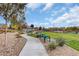 Pathway and benches in a community park at 7174 Steubling Glen St, North Las Vegas, NV 89084