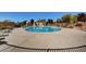 Community pool with surrounding patio and seating at 7174 Steubling Glen St, North Las Vegas, NV 89084