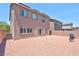 Backyard with gravel, and a built-in grill at 7906 Woolly St, Las Vegas, NV 89149