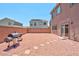 Backyard with gravel and a built in grill at 7906 Woolly St, Las Vegas, NV 89149