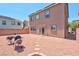 Backyard with gravel and a built-in grill at 7906 Woolly St, Las Vegas, NV 89149