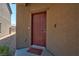 Exterior front door with a welcome mat at 7906 Woolly St, Las Vegas, NV 89149