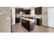 Kitchen with island, stainless steel appliances, and granite countertops at 7906 Woolly St, Las Vegas, NV 89149