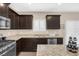 Kitchen with granite countertops and stainless steel appliances at 7906 Woolly St, Las Vegas, NV 89149
