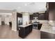 Kitchen with island, stainless steel appliances, and granite countertops at 7906 Woolly St, Las Vegas, NV 89149