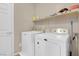 Laundry room with washer, dryer and shelving at 7906 Woolly St, Las Vegas, NV 89149