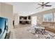 Open living room with view into kitchen and dining area at 7906 Woolly St, Las Vegas, NV 89149