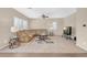 Bright living room, featuring a large sectional sofa and wood-look floors at 7906 Woolly St, Las Vegas, NV 89149