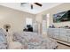 Main bedroom with king bed, en-suite bathroom access, and a home office at 7906 Woolly St, Las Vegas, NV 89149