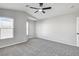 Bright bedroom with ceiling fan and gray carpeting at 8470 Opal Splendor Ave, Las Vegas, NV 89147