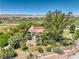House with pool and surrounding landscape, aerial view at 875 Cooper St, Overton, NV 89040