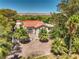 Aerial view of a Spanish-style home with lush landscaping at 875 Cooper St, Overton, NV 89040