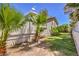 Landscaped backyard with grassy area and palm trees at 875 Cooper St, Overton, NV 89040