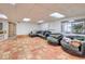 Finished basement with tiled floors and sectional sofa at 875 Cooper St, Overton, NV 89040