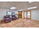 Finished basement with tiled floors and seating area at 875 Cooper St, Overton, NV 89040