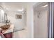 Bathroom with walk-in shower and marble vanity at 875 Cooper St, Overton, NV 89040