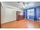 Bedroom with wood floors, ceiling fan, and murphy bed at 875 Cooper St, Overton, NV 89040