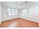 Bedroom with wood floors, ceiling fan, and window coverings at 875 Cooper St, Overton, NV 89040