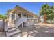 House exterior with covered patio and stairs at 875 Cooper St, Overton, NV 89040