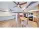 Open kitchen with island, wood cabinets, and wood flooring at 875 Cooper St, Overton, NV 89040