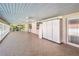 Covered patio with tile flooring, ceiling fan, and storage cabinet at 875 Cooper St, Overton, NV 89040