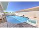 Relaxing kidney-shaped pool with spa and deck at 875 Cooper St, Overton, NV 89040