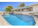 Inviting kidney-shaped pool with surrounding patio at 875 Cooper St, Overton, NV 89040