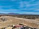 Aerial view of house and surrounding desert landscape at 8870 W Craig Rd, Las Vegas, NV 89129