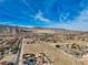 Aerial view of property with mountain views in background at 8870 W Craig Rd, Las Vegas, NV 89129
