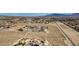Aerial view of property and surrounding desert landscape at 8870 W Craig Rd, Las Vegas, NV 89129